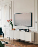 Into the Pacific by Nathan Larson. shown as a framed stretched canvas in a living room above a console. Available as a archival giclee rolled canvas, fine art paper, or poster print. SKU 97437i.