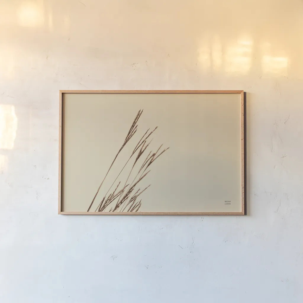 Lakeside Grasses IV by Nathan Larson. shown as a paper print in a natural frame. Available as a archival giclee rolled canvas, fine art paper, or poster print. SKU 76211i.