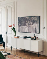 Laundry Day I by Nathan Larson. shown as a framed stretched canvas in a living room above a console. Available as a archival giclee rolled canvas, fine art paper, or poster print. SKU 99407i.