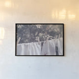 Laundry Day I by Nathan Larson. shown as a paper print in a black flame. Available as a archival giclee rolled canvas, fine art paper, or poster print. SKU 99407i.