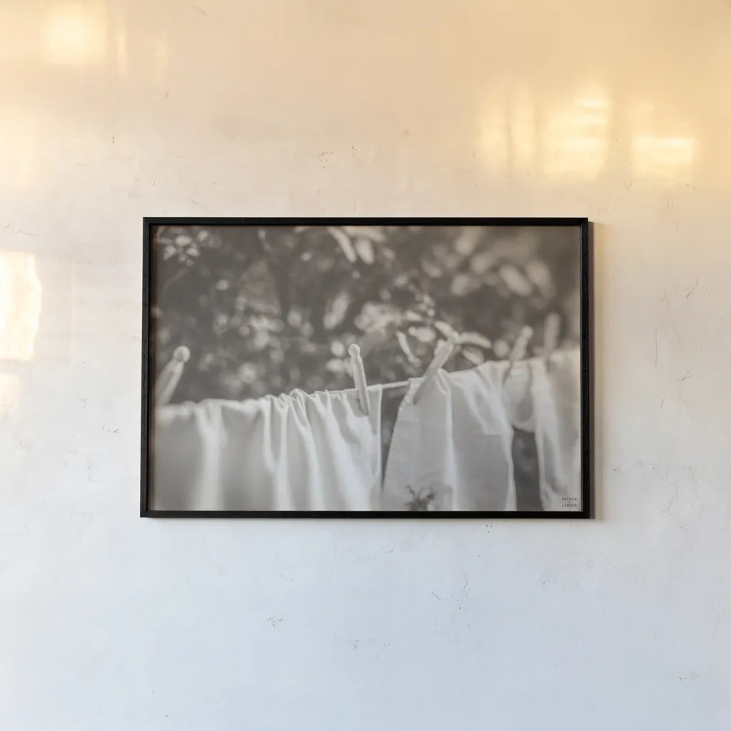 Laundry Day I Neutral by Nathan Larson. shown as a paper print in a black flame. Available as a archival giclee rolled canvas, fine art paper, or poster print. SKU 99411i.