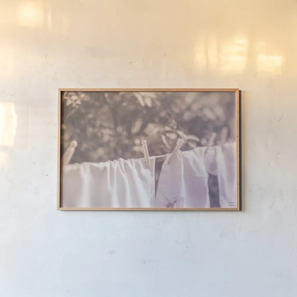 Laundry Day I Pastel by Nathan Larson. shown as a paper print in a natural frame. Available as a archival giclee rolled canvas, fine art paper, or poster print. SKU 99409i.