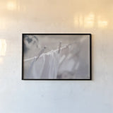 Laundry Day II by Nathan Larson. shown as a paper print in a black flame. Available as a archival giclee rolled canvas, fine art paper, or poster print. SKU 99408i.