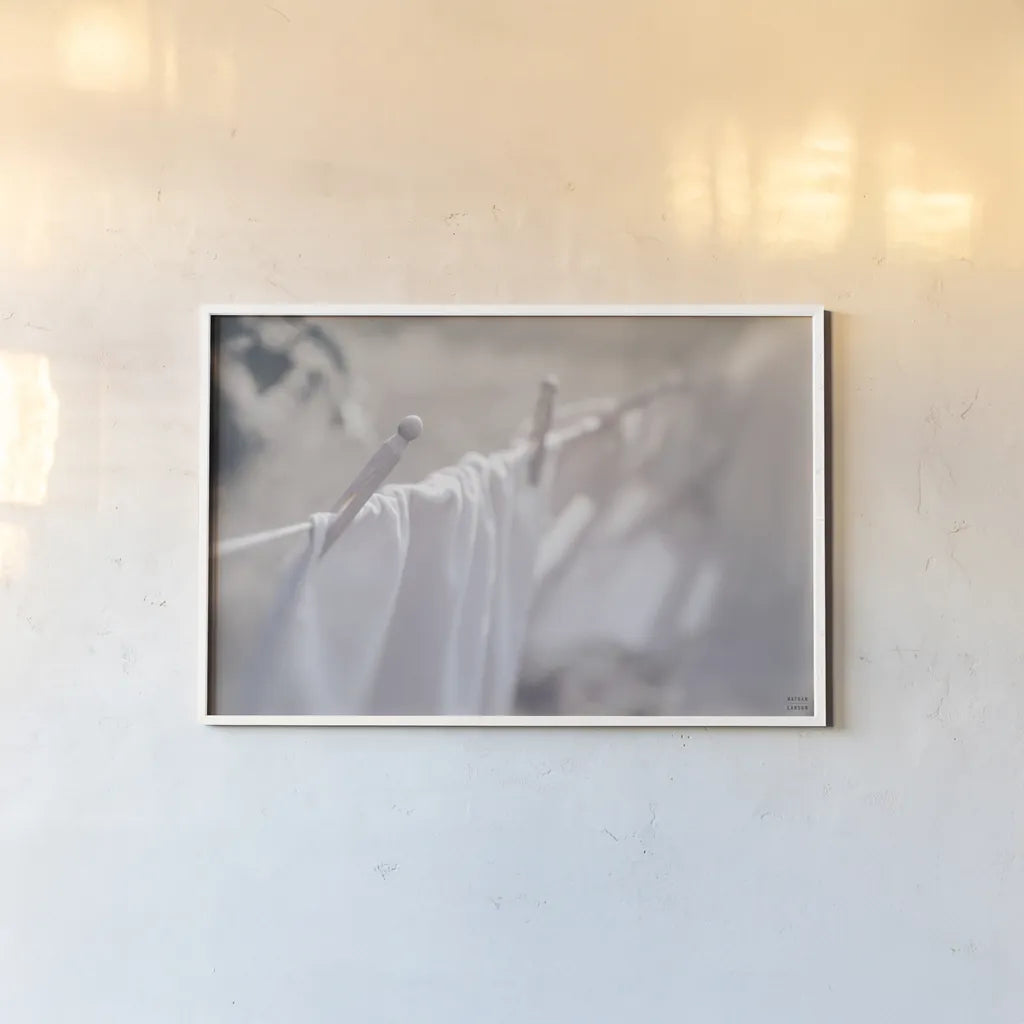 Laundry Day II by Nathan Larson. shown as a paper print in a white frame. Available as a archival giclee rolled canvas, fine art paper, or poster print. SKU 99408i.