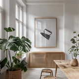Laundry Iron Antique by Nathan Larson. shown as a print in a natural wood frame in a dining room. Available as a archival giclee rolled canvas, fine art paper, or poster print. SKU 99393h.