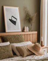 Laundry Iron Antique by Nathan Larson. shown as a paper print in a natural frame. Available as a archival giclee rolled canvas, fine art paper, or poster print. SKU 99393h.