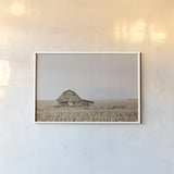 Leaning Barn by Nathan Larson. shown as a paper print in a white frame. Available as a archival giclee rolled canvas, fine art paper, or poster print. SKU 86062i.
