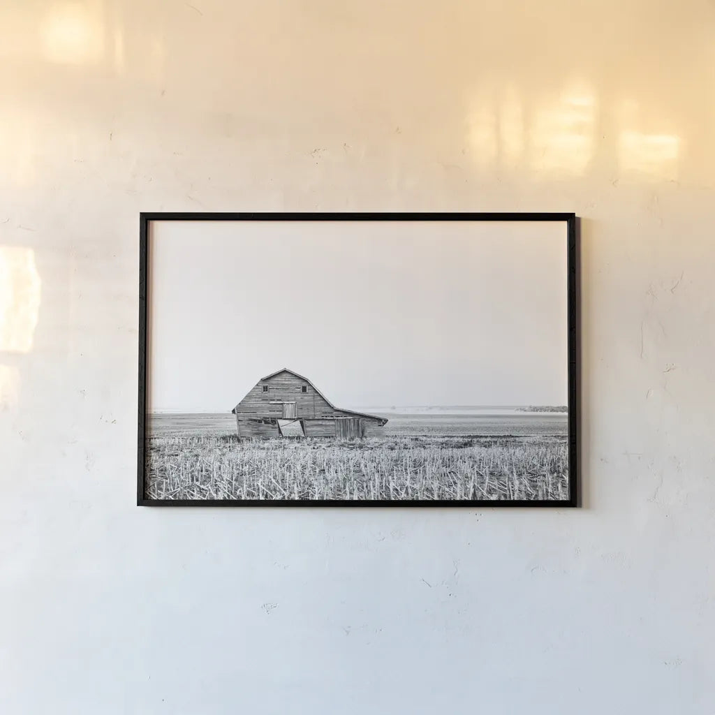 Leaning Barn BW by Nathan Larson. shown as a paper print in a black flame. Available as a archival giclee rolled canvas, fine art paper, or poster print. SKU 86064i.