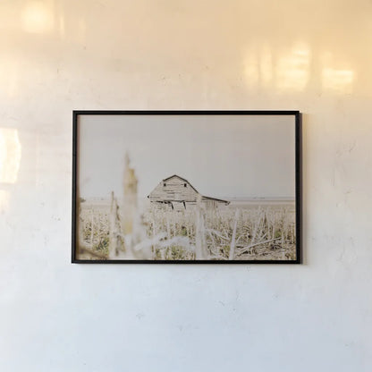 Leaning Barn Field I by Nathan Larson. shown as a paper print in a black flame. Available as a archival giclee rolled canvas, fine art paper, or poster print. SKU 86060i.