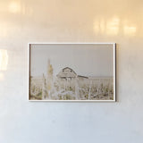 Leaning Barn Field I by Nathan Larson. shown as a paper print in a white frame. Available as a archival giclee rolled canvas, fine art paper, or poster print. SKU 86060i.