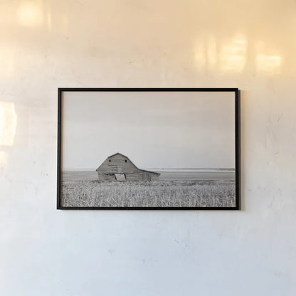 Leaning Barn Neutral by Nathan Larson. shown as a paper print in a black flame. Available as a archival giclee rolled canvas, fine art paper, or poster print. SKU 86063i.