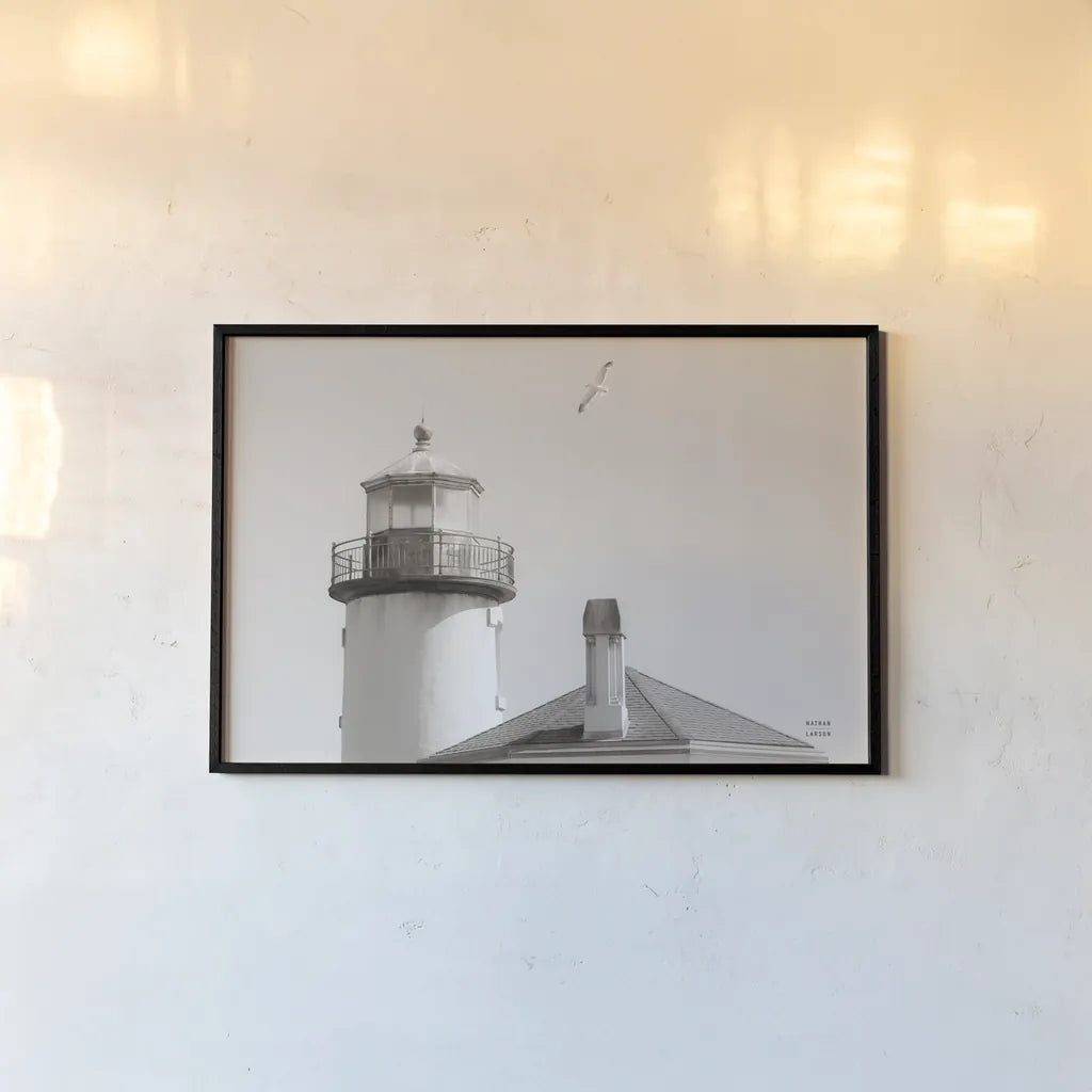 Lighthouse Fly Over by Nathan Larson. shown as a paper print in a black flame. Available as a archival giclee rolled canvas, fine art paper, or poster print. SKU 87193i.