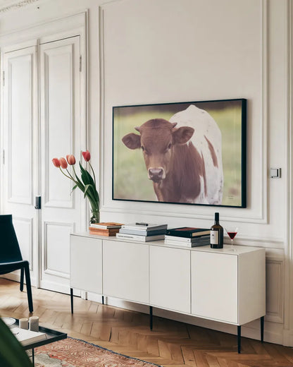 Little Longhorn by Nathan Larson. shown as a framed stretched canvas in a living room above a console. Available as a archival giclee rolled canvas, fine art paper, or poster print. SKU 92466i.