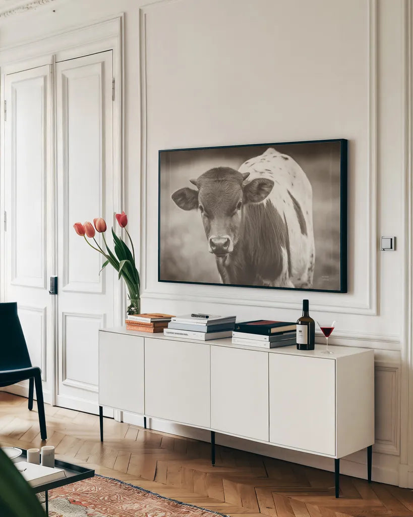 Little Longhorn Sepia by Nathan Larson. shown as a framed stretched canvas in a living room above a console. Available as a archival giclee rolled canvas, fine art paper, or poster print. SKU 92467i.
