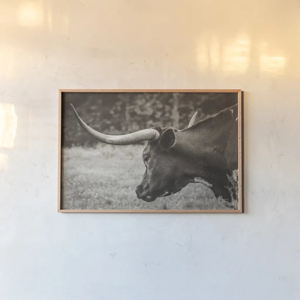 Longhorn Evening Sepia by Nathan Larson. shown as a paper print in a natural frame. Available as a archival giclee rolled canvas, fine art paper, or poster print. SKU 91379i.