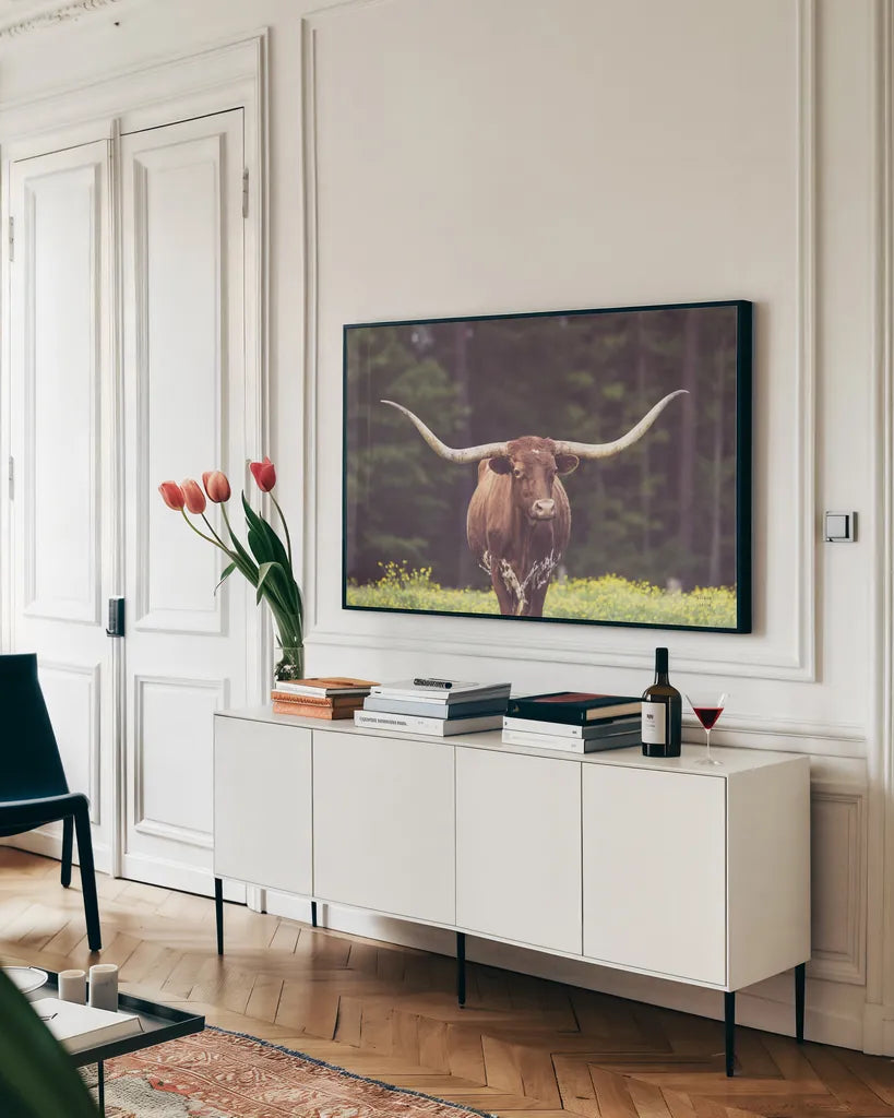 Longhorn Flowers by Nathan Larson. shown as a framed stretched canvas in a living room above a console. Available as a archival giclee rolled canvas, fine art paper, or poster print. SKU 91518i.