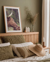 Longhorn Pair by Nathan Larson. shown as a paper print in a natural frame. Available as a archival giclee rolled canvas, fine art paper, or poster print. SKU 91374h.