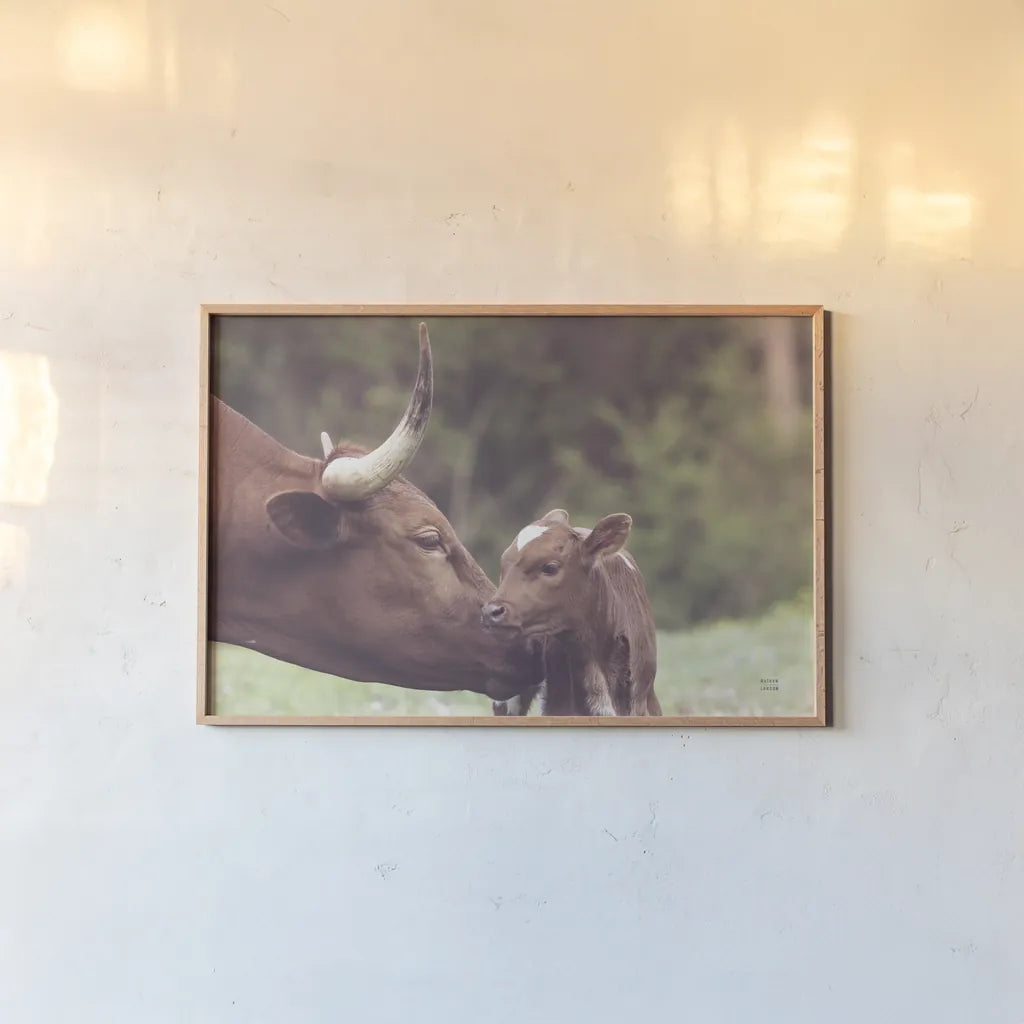 Longhorn Pairing by Nathan Larson. shown as a paper print in a natural frame. Available as a archival giclee rolled canvas, fine art paper, or poster print. SKU 91898i.
