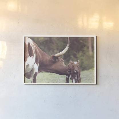 Longhorn Pasture Pair by Nathan Larson. shown as a paper print in a white frame. Available as a archival giclee rolled canvas, fine art paper, or poster print. SKU 93356i.