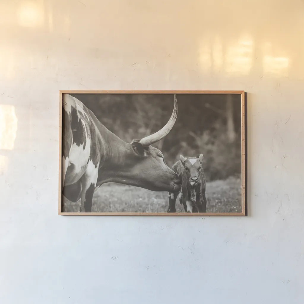 Longhorn Pasture Pair Sepia by Nathan Larson. shown as a paper print in a natural frame. Available as a archival giclee rolled canvas, fine art paper, or poster print. SKU 93357i.