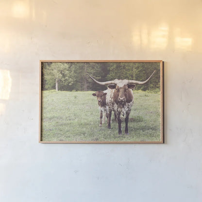 Longhorn Protection by Nathan Larson. shown as a paper print in a natural frame. Available as a archival giclee rolled canvas, fine art paper, or poster print. SKU 91520i.