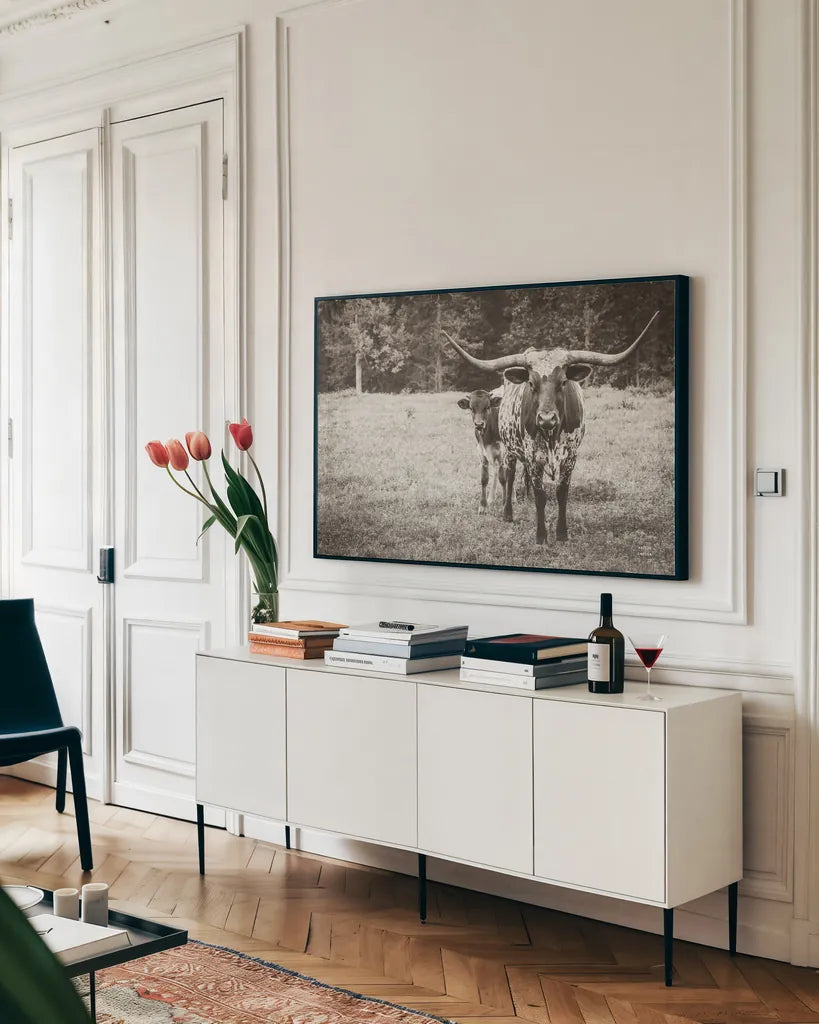 Longhorn Protection Sepia by Nathan Larson. shown as a framed stretched canvas in a living room above a console. Available as a archival giclee rolled canvas, fine art paper, or poster print. SKU 91521i.