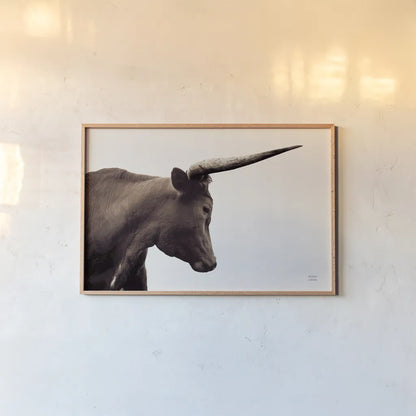 Longhorn Sunset Graze Sepia by Nathan Larson. shown as a paper print in a natural frame. Available as a archival giclee rolled canvas, fine art paper, or poster print. SKU 92289i.