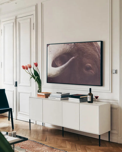 Longhorn Watch by Nathan Larson. shown as a framed stretched canvas in a living room above a console. Available as a archival giclee rolled canvas, fine art paper, or poster print. SKU 92322i.