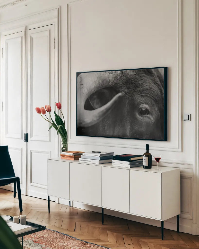 Longhorn Watch BW by Nathan Larson. shown as a framed stretched canvas in a living room above a console. Available as a archival giclee rolled canvas, fine art paper, or poster print. SKU 92323i.