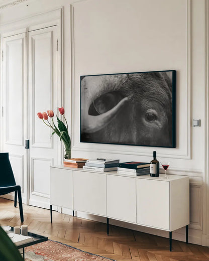 Longhorn Watch BW by Nathan Larson. shown as a framed stretched canvas in a living room above a console. Available as a archival giclee rolled canvas, fine art paper, or poster print. SKU 92323i.
