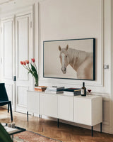 Looking Back Light by Nathan Larson. shown as a framed stretched canvas in a living room above a console. Available as a archival giclee rolled canvas, fine art paper, or poster print. SKU 104780i.