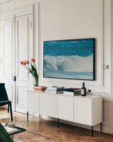 Lost Coast Waves V by Nathan Larson. shown as a framed stretched canvas in a living room above a console. Available as a archival giclee rolled canvas, fine art paper, or poster print. SKU 87000i.