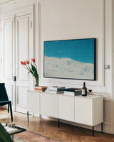 Lost Coast Waves VI by Nathan Larson. shown as a framed stretched canvas in a living room above a console. Available as a archival giclee rolled canvas, fine art paper, or poster print. SKU 87001i.