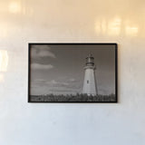 Low Point Lighthouse by Nathan Larson. shown as a paper print in a black flame. Available as a archival giclee rolled canvas, fine art paper, or poster print. SKU 100499i.