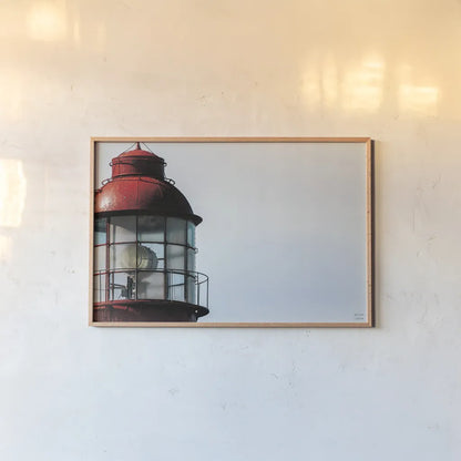 Low Point Lighthouse View by Nathan Larson. shown as a paper print in a natural frame. Available as a archival giclee rolled canvas, fine art paper, or poster print. SKU 100498i.