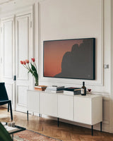 Make Me Your Sunset III by Nathan Larson. shown as a framed stretched canvas in a living room above a console. Available as a archival giclee rolled canvas, fine art paper, or poster print. SKU 82423i.