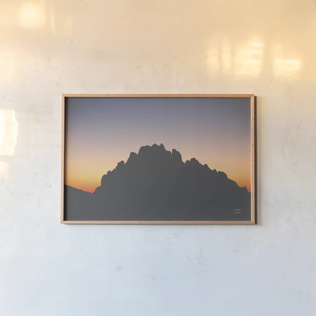 Make Me Your Sunset IV by Nathan Larson. shown as a paper print in a natural frame. Available as a archival giclee rolled canvas, fine art paper, or poster print. SKU 82424i.