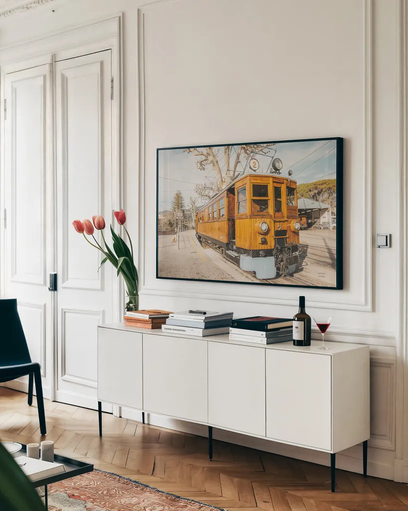 Mallorca Train by Nathan Larson. shown as a framed stretched canvas in a living room above a console. Available as a archival giclee rolled canvas, fine art paper, or poster print. SKU 85801i.