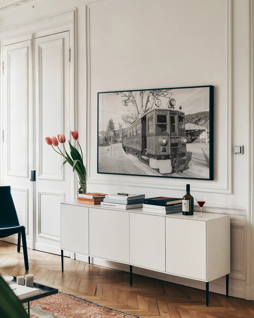 Mallorca Train BW by Nathan Larson. shown as a framed stretched canvas in a living room above a console. Available as a archival giclee rolled canvas, fine art paper, or poster print. SKU 85802i.