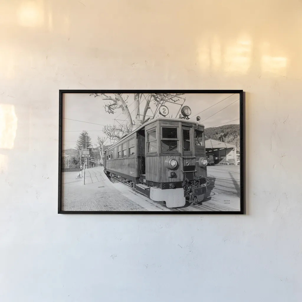 Mallorca Train BW by Nathan Larson. shown as a paper print in a black flame. Available as a archival giclee rolled canvas, fine art paper, or poster print. SKU 85802i.