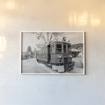 Mallorca Train BW by Nathan Larson. shown as a paper print in a white frame. Available as a archival giclee rolled canvas, fine art paper, or poster print. SKU 85802i.