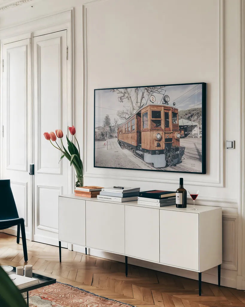 Mallorca Train Neutral by Nathan Larson. shown as a framed stretched canvas in a living room above a console. Available as a archival giclee rolled canvas, fine art paper, or poster print. SKU 85803i.