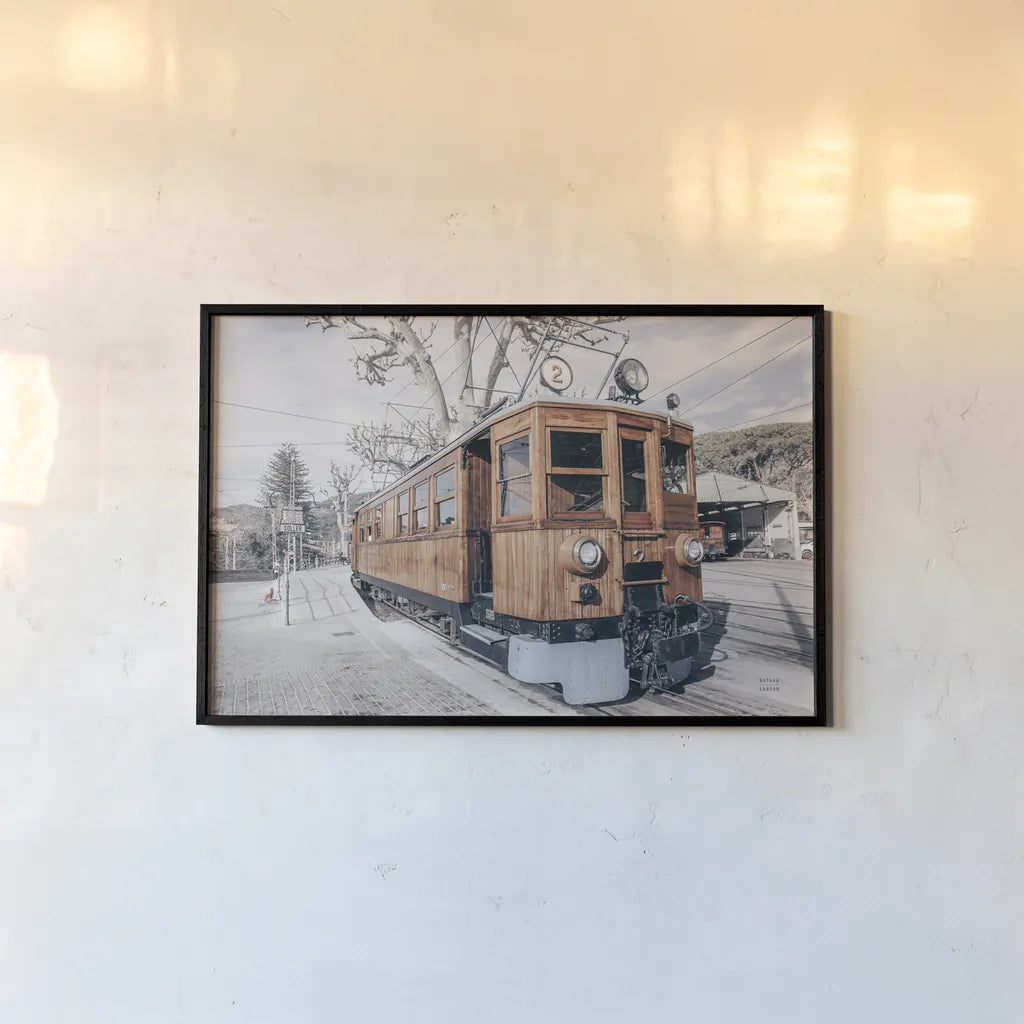 Mallorca Train Neutral by Nathan Larson. shown as a paper print in a black flame. Available as a archival giclee rolled canvas, fine art paper, or poster print. SKU 85803i.