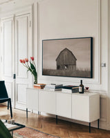 Middle America Sepia by Nathan Larson. shown as a framed stretched canvas in a living room above a console. Available as a archival giclee rolled canvas, fine art paper, or poster print. SKU 98152i.