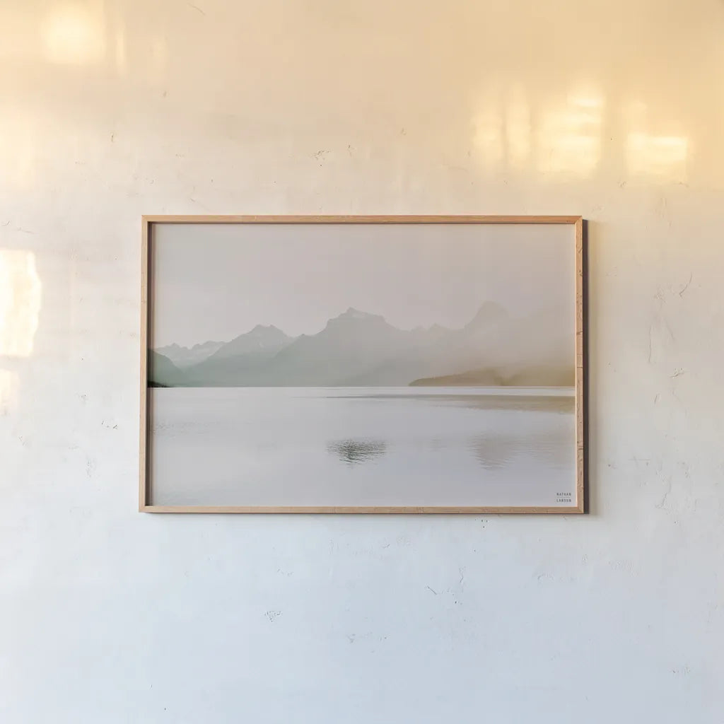 Montana Light II by Nathan Larson. shown as a paper print in a natural frame. Available as a archival giclee rolled canvas, fine art paper, or poster print. SKU 98329i.