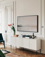 Montana Light III by Nathan Larson. shown as a framed stretched canvas in a living room above a console. Available as a archival giclee rolled canvas, fine art paper, or poster print. SKU 98330i.