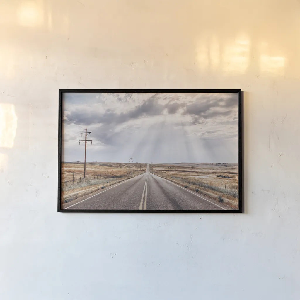 Montana Skies by Nathan Larson. shown as a paper print in a black flame. Available as a archival giclee rolled canvas, fine art paper, or poster print. SKU 77276i.