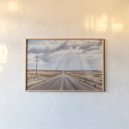 Montana Skies by Nathan Larson. shown as a paper print in a natural frame. Available as a archival giclee rolled canvas, fine art paper, or poster print. SKU 77276i.