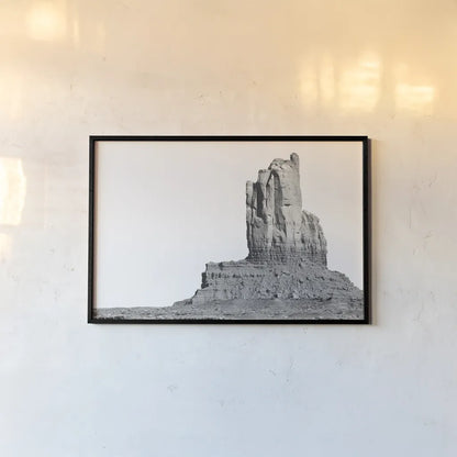 Monument Valley I by Nathan Larson. shown as a paper print in a black flame. Available as a archival giclee rolled canvas, fine art paper, or poster print. SKU 86708i.