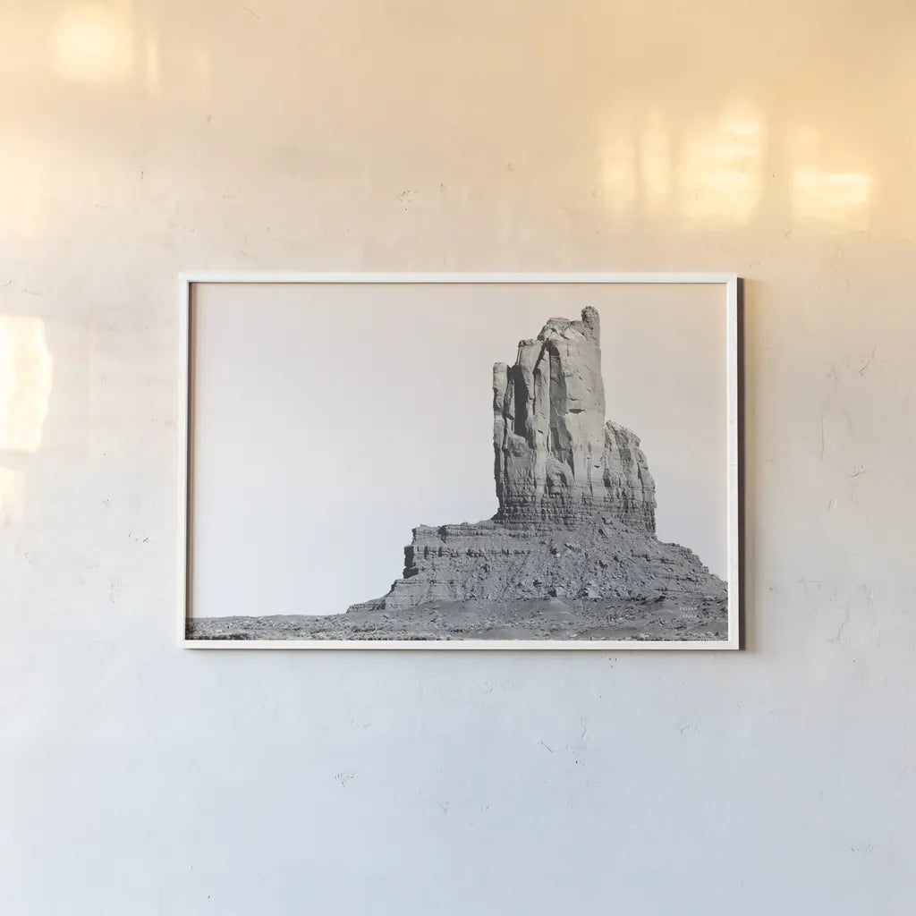 Monument Valley I by Nathan Larson. shown as a paper print in a white frame. Available as a archival giclee rolled canvas, fine art paper, or poster print. SKU 86708i.